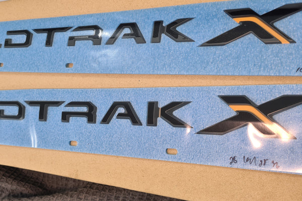 GENUINE WILDTRAK X LOGO EMBLEM BADGES ON FRONT DOOR LEFT & RIGHT 2022-2026