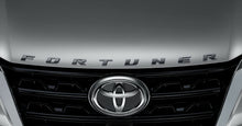 Load image into Gallery viewer, GENUINE BONNET EMBLEM PIANO BLACK FOR  TOYOTA FORTUNER 2005-2024