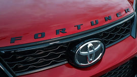 GENUINE BONNET EMBLEM PIANO BLACK FOR  TOYOTA FORTUNER 2005-2025