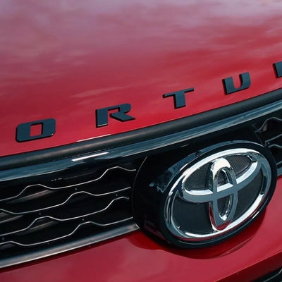 GENUINE BONNET EMBLEM PIANO BLACK FOR  TOYOTA FORTUNER 2005-2025